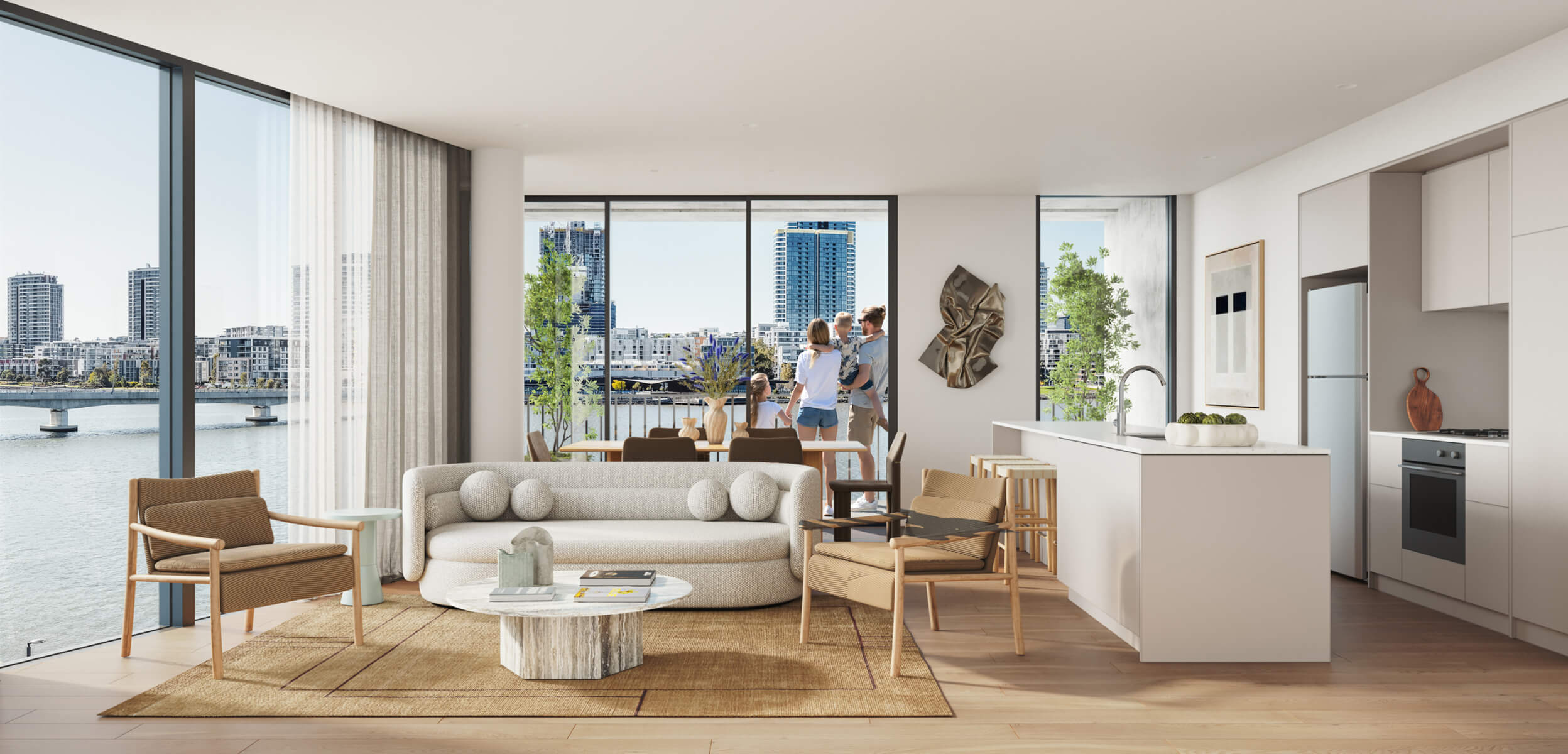 An open plan living room and kitchen in a Wentworth Quarter apartment. The windows overlook the waterfront and Rhodes.