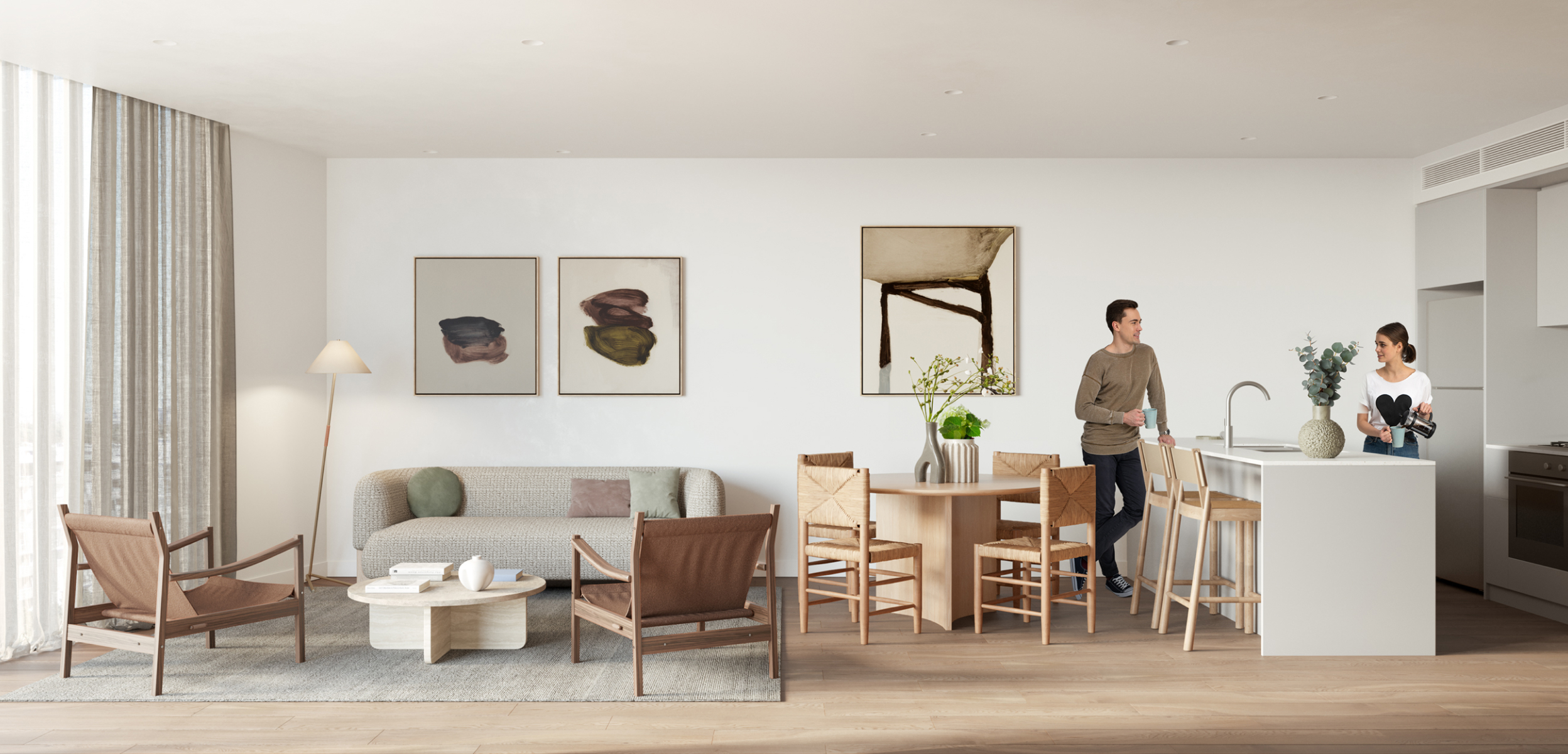 An open plan living room and kitchen in a Wentworth Quarter apartment. The space is artfully decorated with modern furniture and apartment finishes.